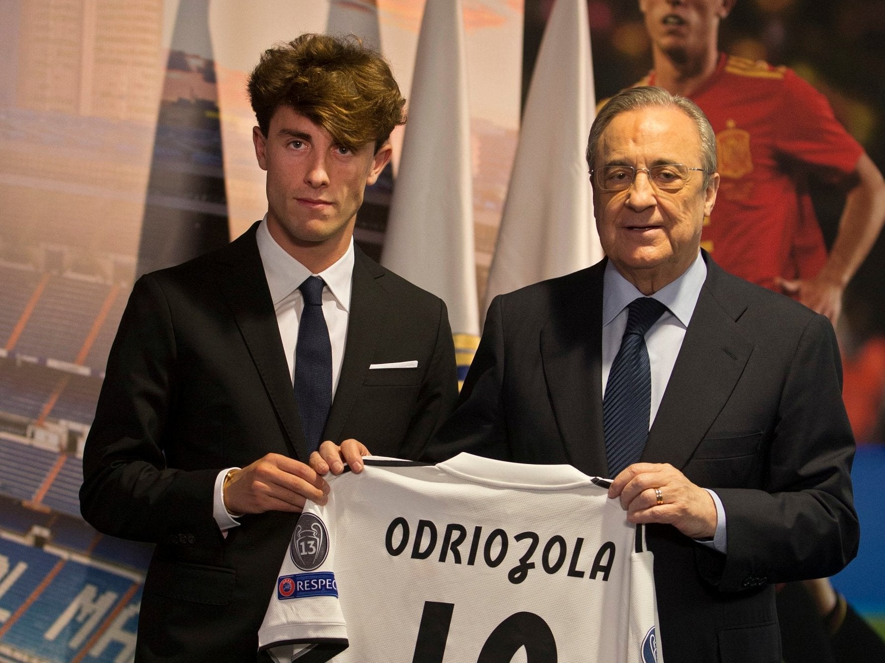 Alvaro Odriozola, left, holds his new jersey next to Real Madrid president Florentino Perez