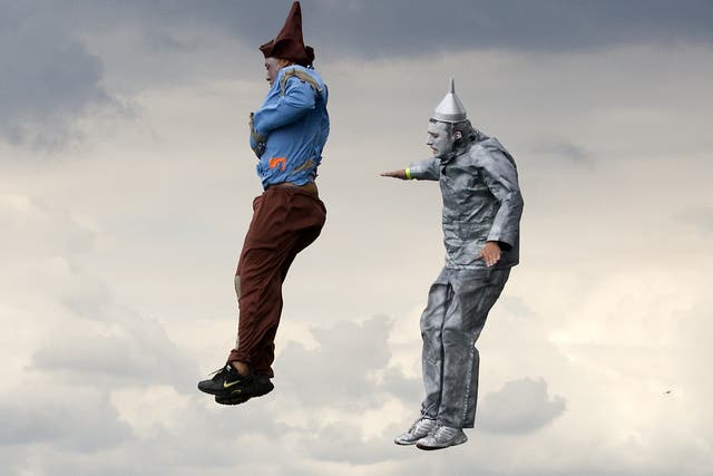 Competitors in fancy dress jump off Worthing Pier in West Sussex during the annual international birdman competition, a flight contest for human-powered flying machines