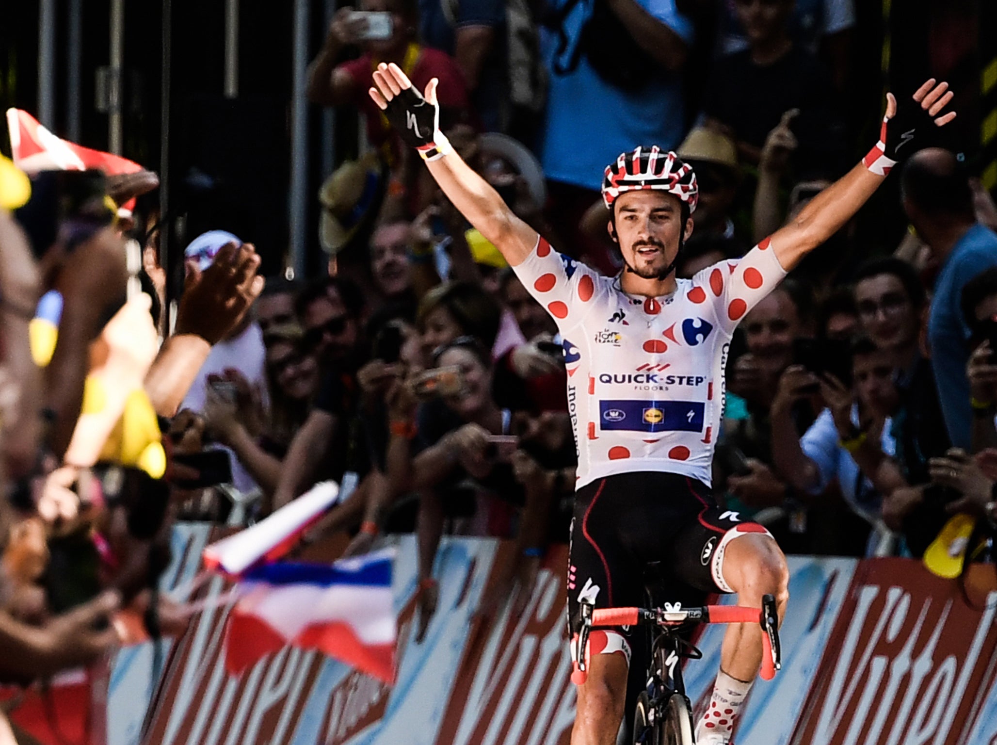 Julian Alaphilippe celebrates victory on the line