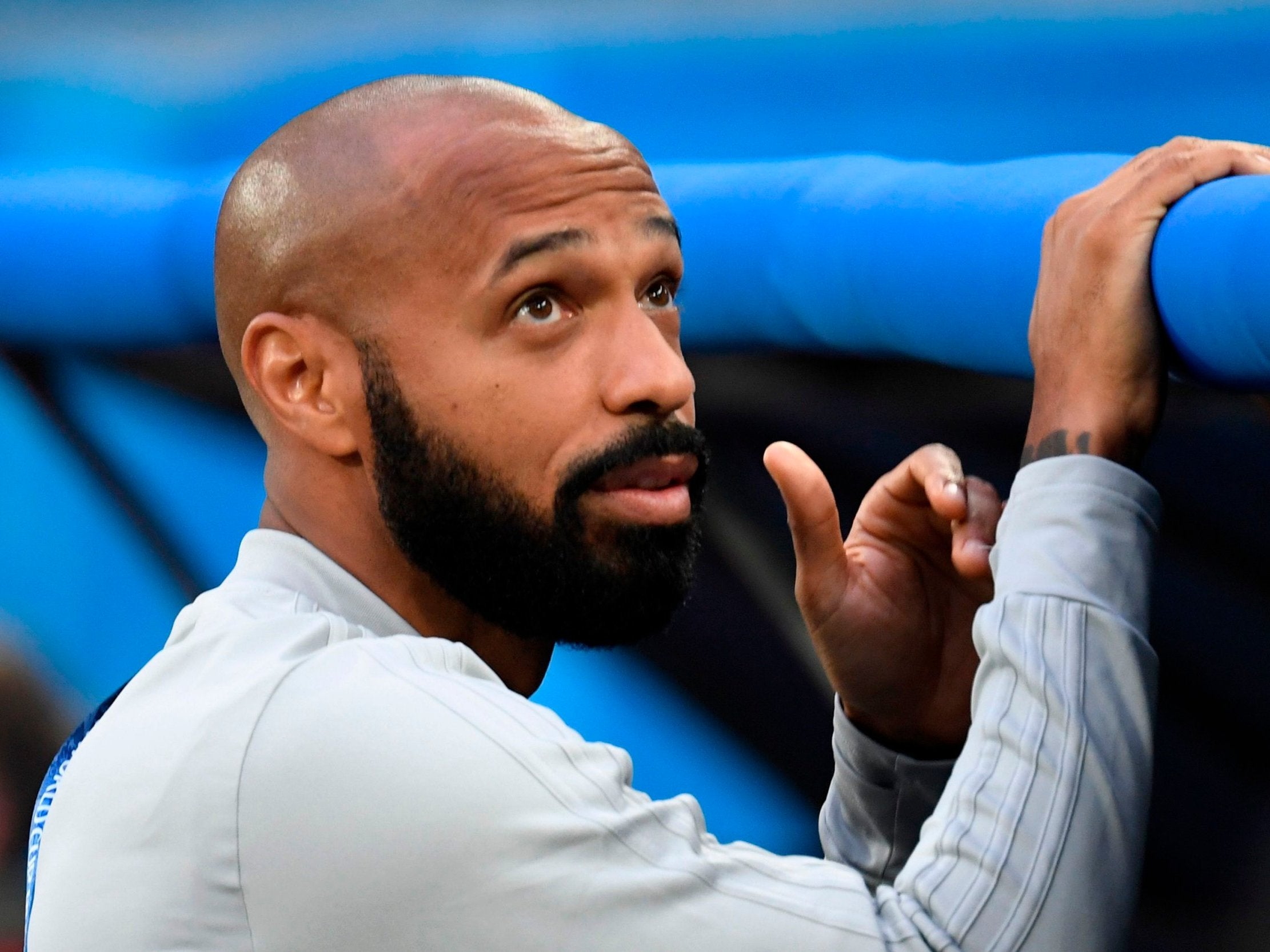 Belgium's assistant coach Thierry Henry looks on