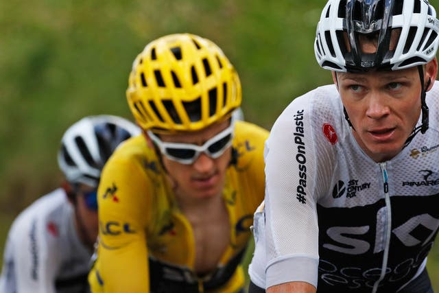 Chris Froome, right, leads before teammates Britain's Geraint Thomas, wearing the overall leader's yellow jersey