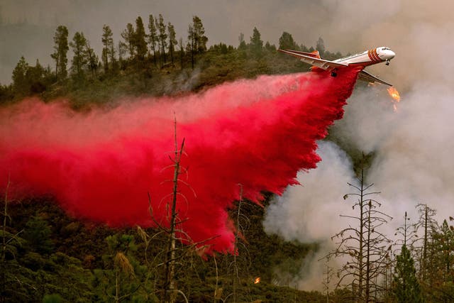 An air tanker drops retardant while battling the Ferguson fire, near Yosemite National Park.