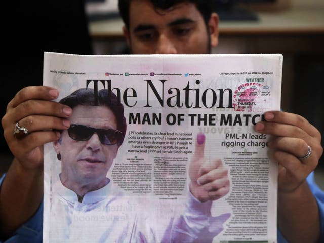 Imran Khan on the front page of a newspaper the day after general elections, in Karachi, Pakistan