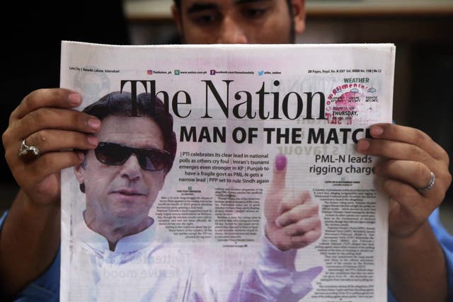 Imran Khan on the front page of a newspaper the day after general elections, in Karachi, Pakistan