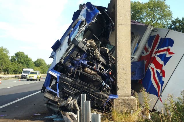 Handout issued by Lancashire Police of a lorry that has crashed into a bridge on the M6 near Broughton