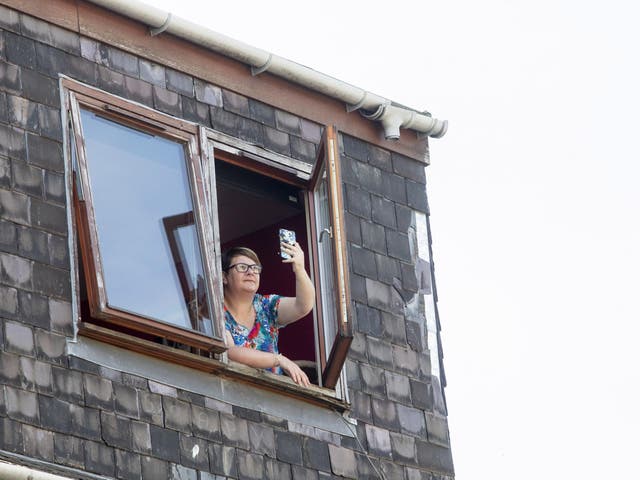 Tracey Kutluol from Galashiels in the Scottish Borders whose phone was struck by lightning when she was leaning out of her top floor window to film the storm