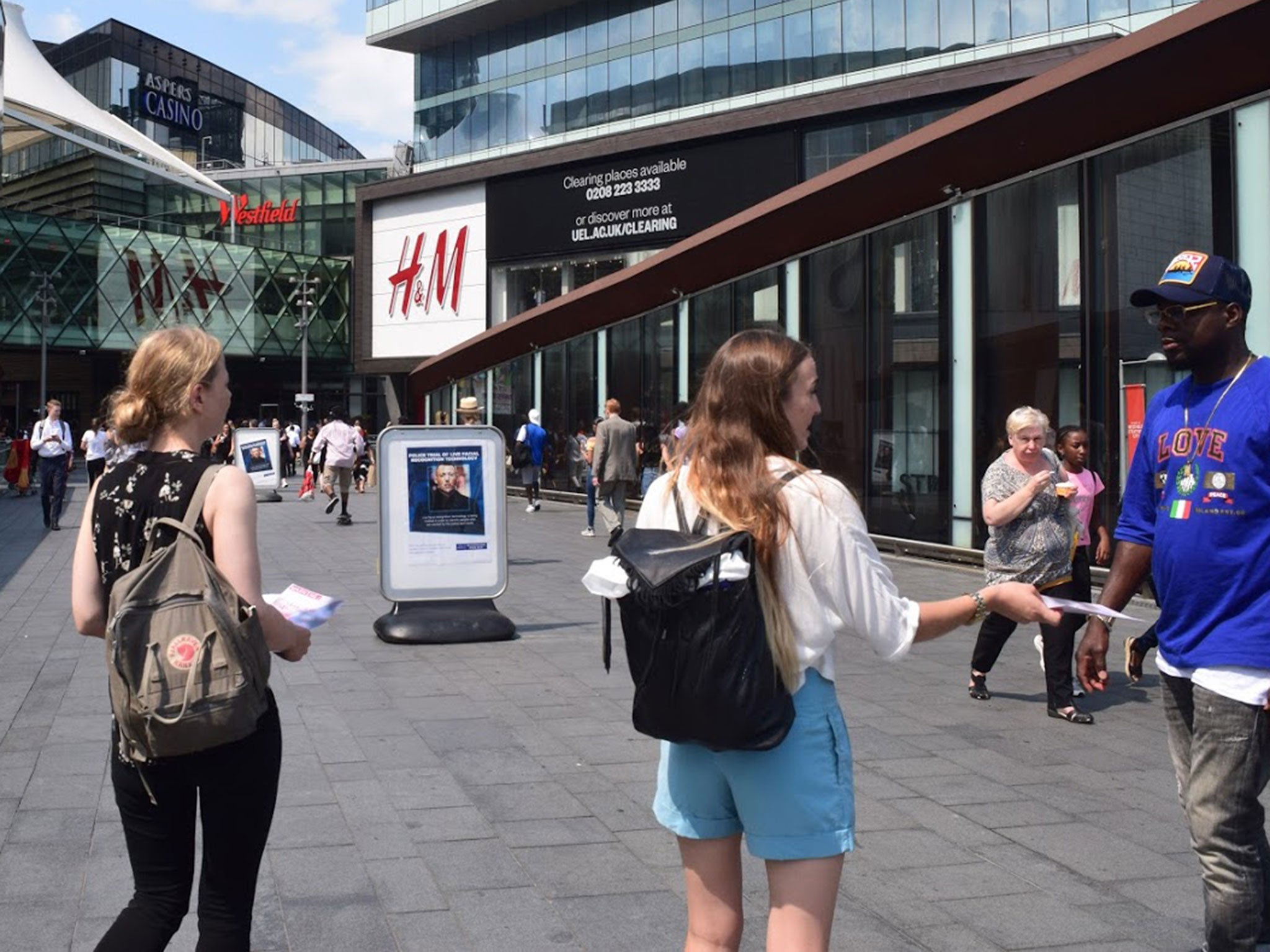 Members of Big Brother Watch hand out leaflets during a Metropolitan Police trial of facial recognition in Stratford, London, on 26 July
