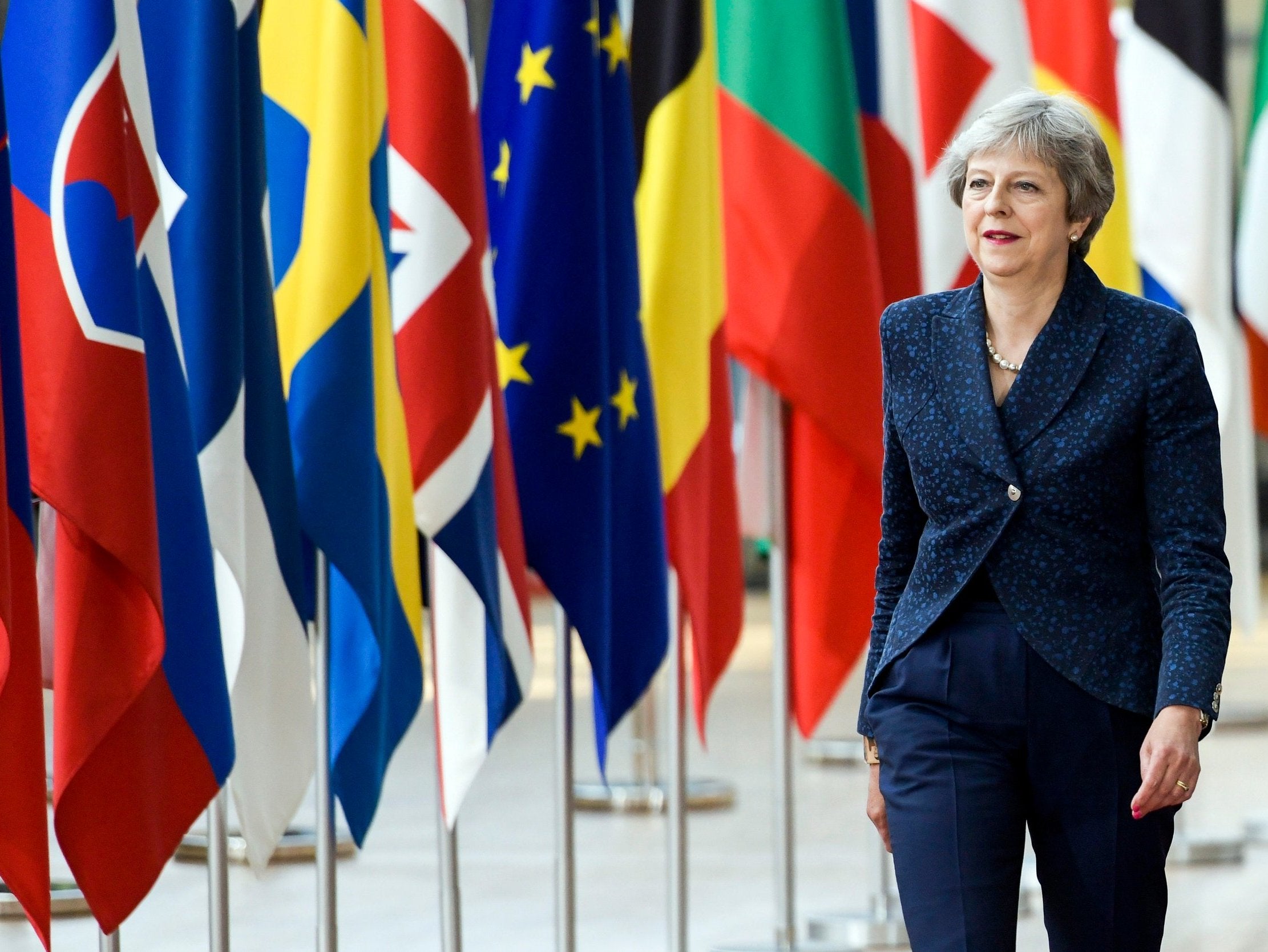 Theresa May arrives for an European Council summit in Brussels on 28 June 2018