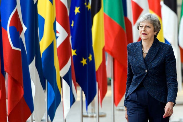 Theresa May arrives for an European Council summit in Brussels on 28 June 2018