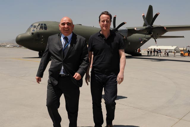 Former ambassador Sir William Patey walks with David Cameron as he arrives in Afghanistan in 2010