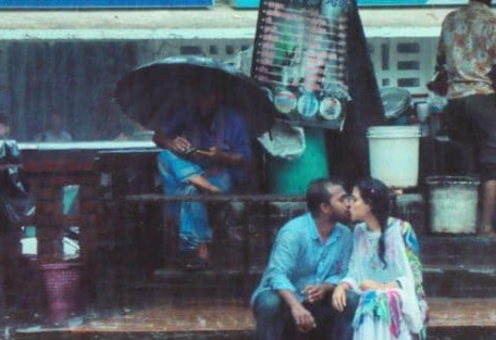 A Bangladeshi photographer took a photo of a couple kissing in the rain. He was beaten up and fired by his colleagues
