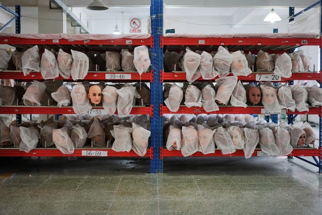 <p>File. Doll heads in dust bags are seen at a factory in Zhongshan, Guangdong, on 11 July 2018</p>