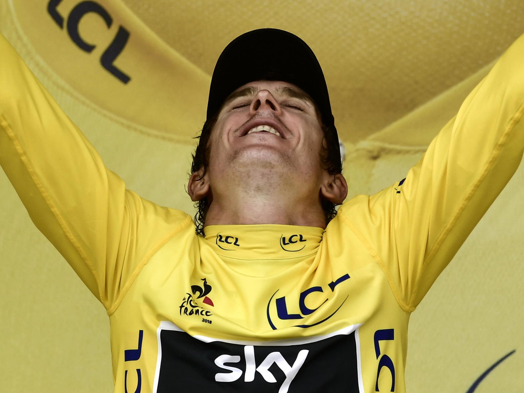 Geraint Thomas celebrates on the podium