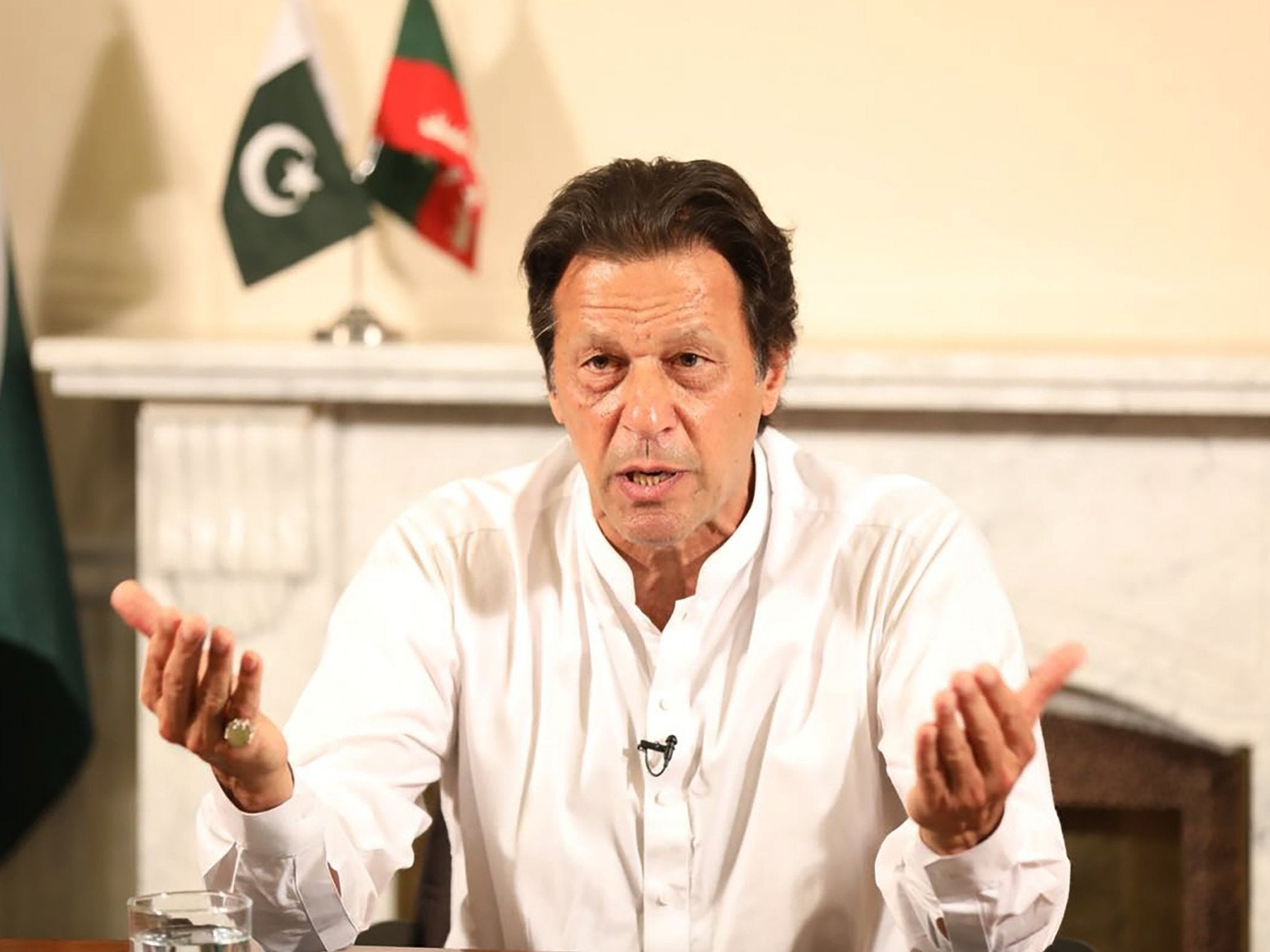 Pakistan's cricketer-turned politician Imran Khan, and head of the Pakistan Tehreek-e-Insaf (Movement for Justice) party, addresses the nation at his residence in Islamabad a day after general election