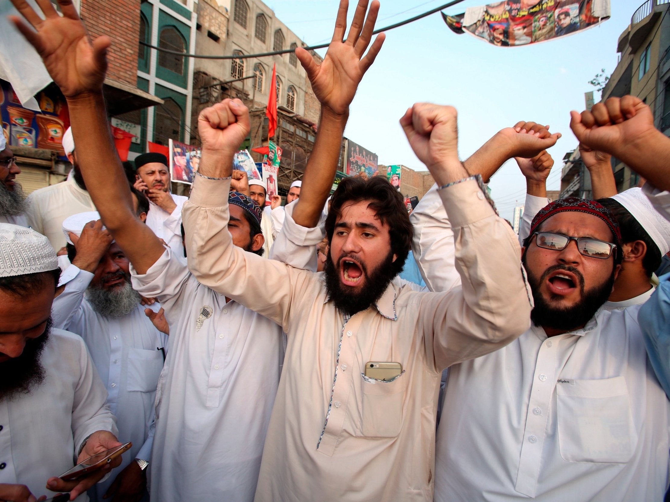 Supporters of different political parties demonstrate to reject the election results in Peshawar, Pakistan