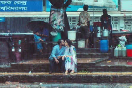 A Bangladeshi photographer took a photo of a couple kissing in the rain photo pic