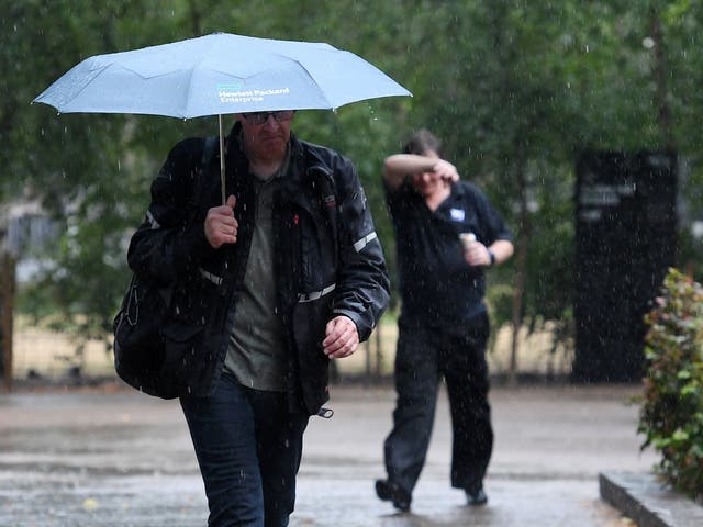 People walk through the rain in London