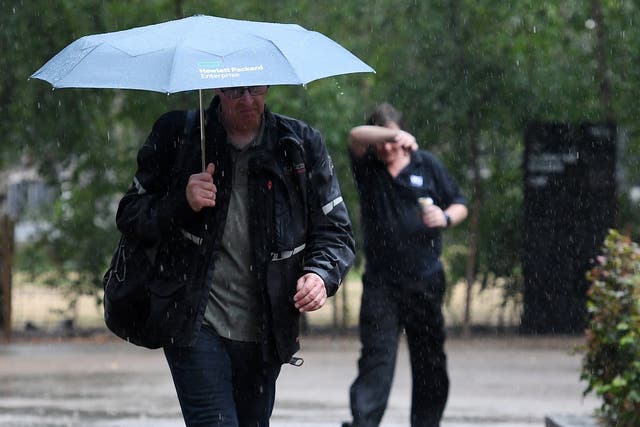 People walk through the rain in London