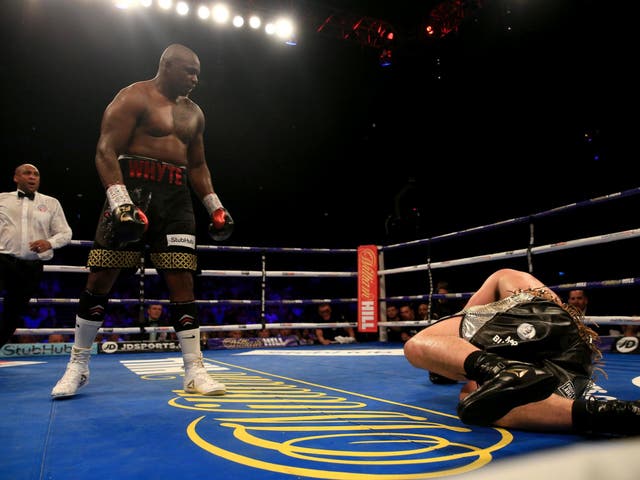 <p>Dillian Whyte looks on after flooring Joseph Parker on Saturday night</p>