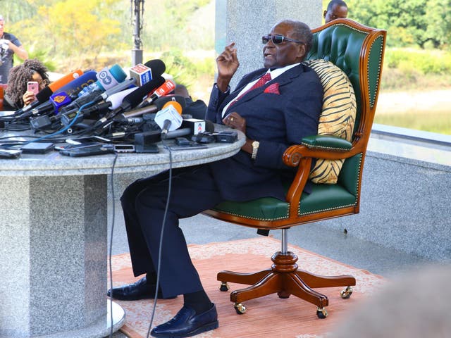 Former president of Zimbabwe Robert Mugabe delivers a speech from the Blue House in Harare