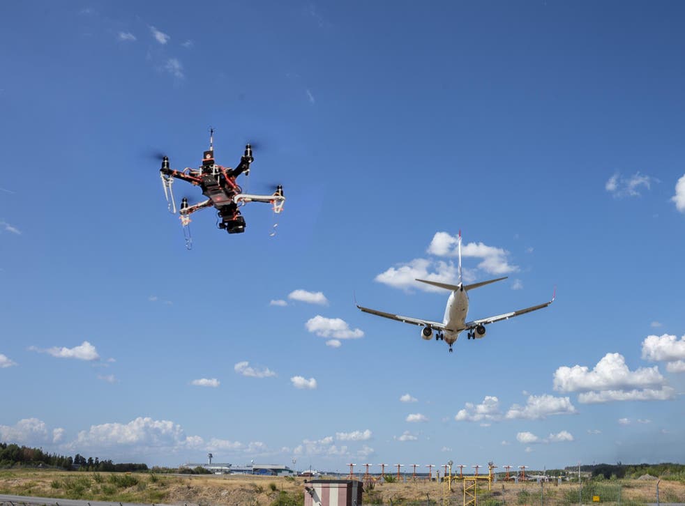 A drone flying dangerous close to an aeroplane