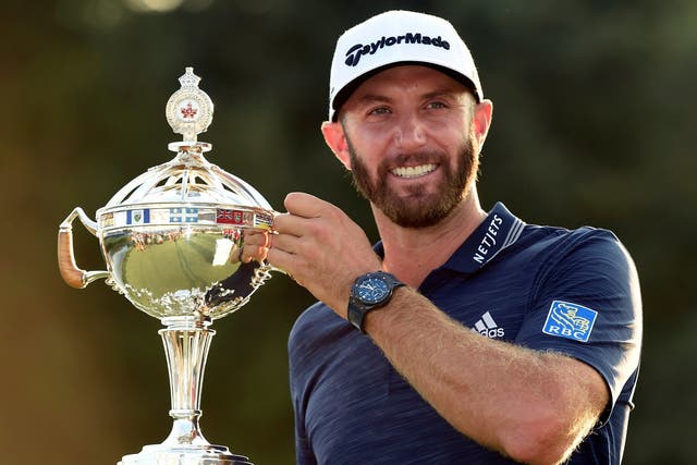 Dustin Johnson celebrates winning the Canadian Open to bag his third title of the year