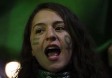 Three women stabbed by masked group at anti-abortion protest in Chile