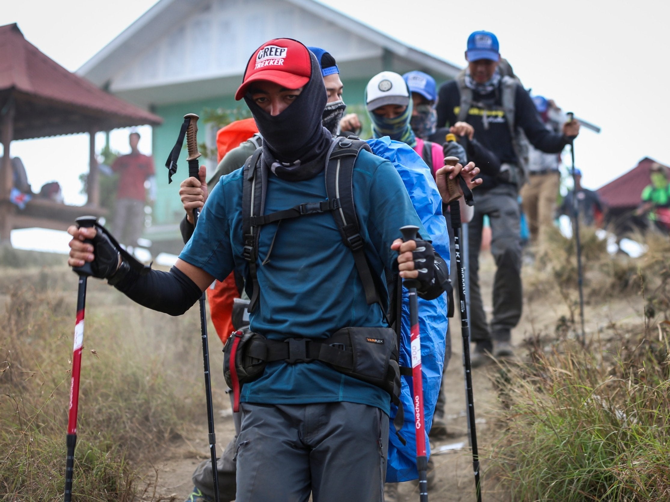 Local and foreign climbers walk down from Mount Rinjani during an evacuation after the earthquake in Lombok