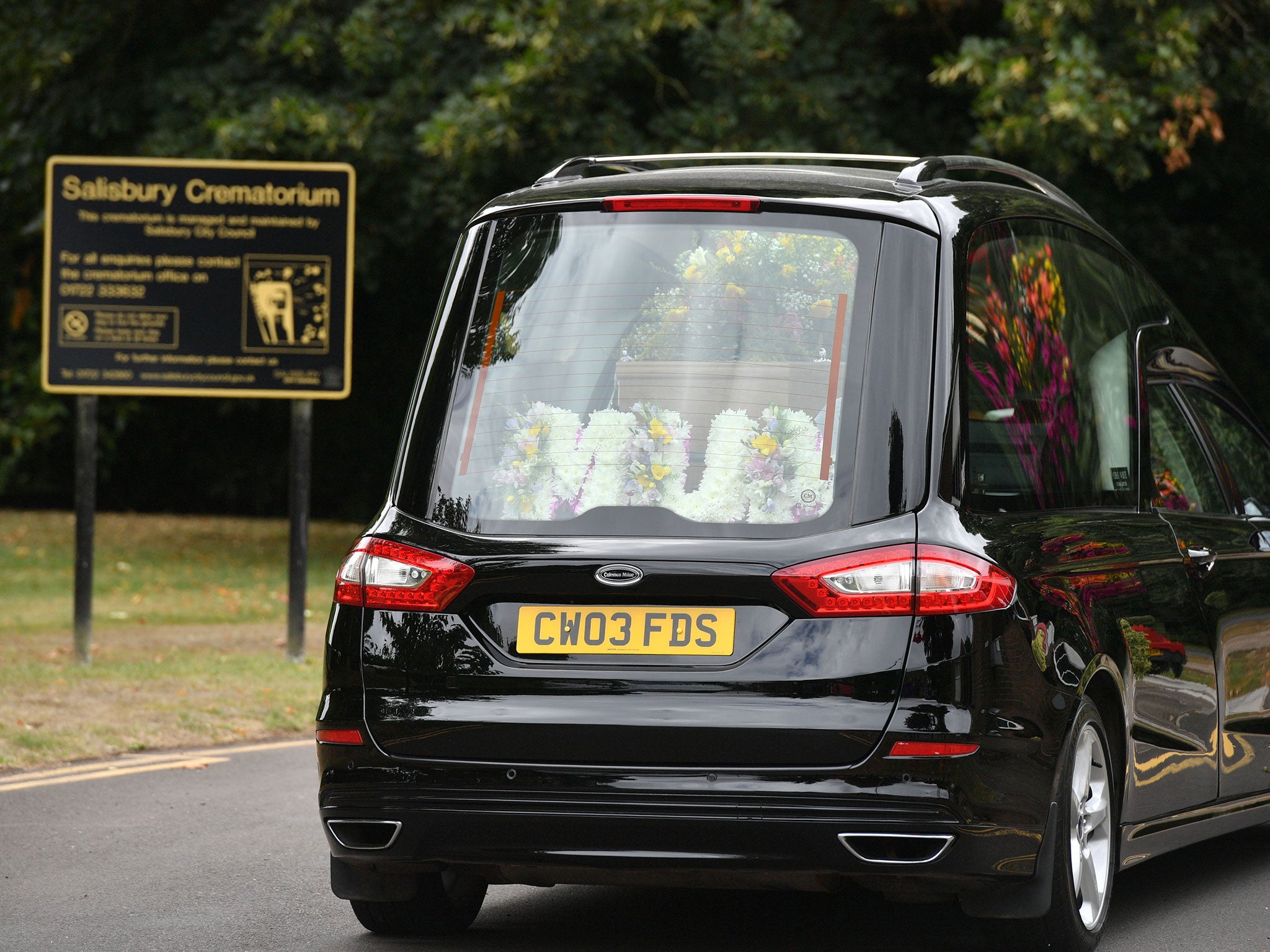 A floral arrangement reading 'Mum' in a hearse carrying Dawn Sturgess' coffin to her funeral at Salisbury Crematorium on 30 July