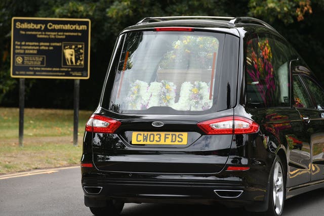 A floral arrangement reading 'Mum' in a hearse carrying Dawn Sturgess' coffin to her funeral at Salisbury Crematorium on 30 July