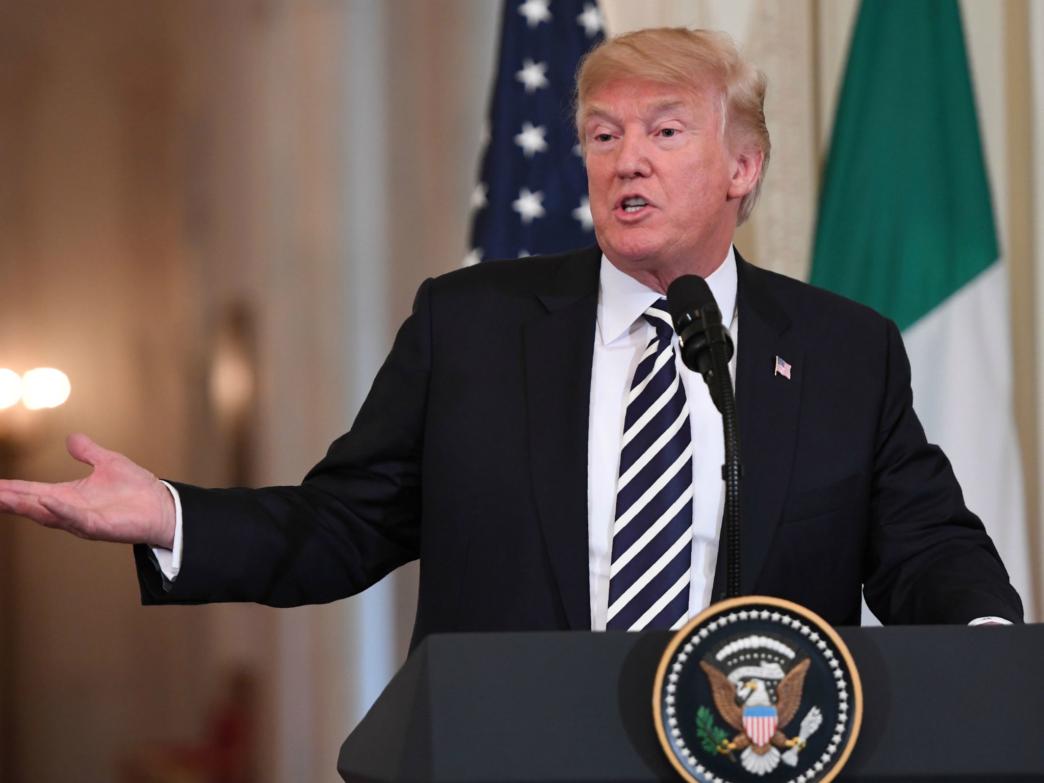 US President Donald Trump doubles down on his threat to shut down the government over funding for his border wall with Mexico during a joint press conference with Italian Prime Minister Giuseppe Conte.