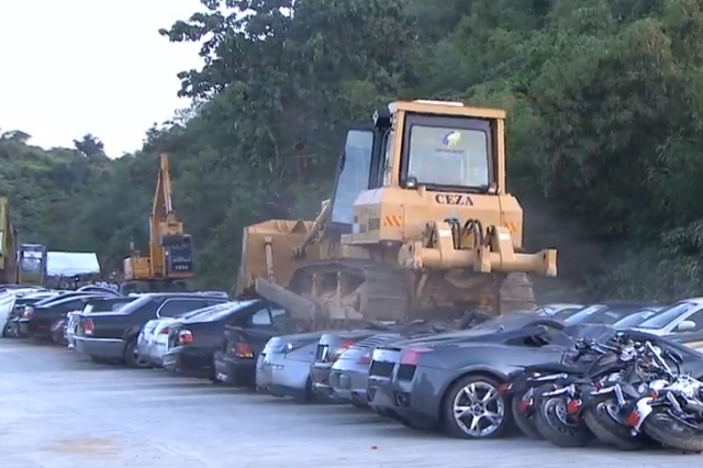 Bulldozers crush luxury cars in the Philippines