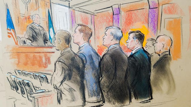 Former Trump campaign manager Paul Manafort stands with his attorneys before U.S. District Judge TS Ellis in a court room sketch, on the opening day of his trial