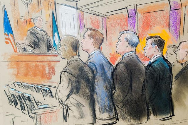 Former Trump campaign manager Paul Manafort stands with his attorneys before U.S. District Judge T.S. Ellis in a court room sketch, on the opening day of his trial on bank and tax fraud charges stemming from Special Counsel Robert Mueller's investigation into Russian meddling in the 2016 U.S. presidential election, in Alexandria, Virginia, U.S. July 31, 2018.