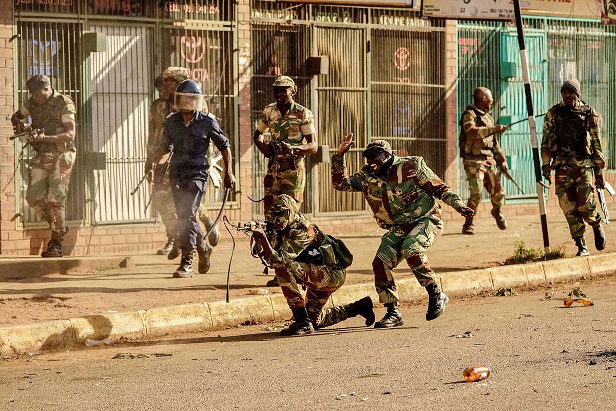 Zimbabwe election: Three dead in violent Harare protests as security forces battle demonstrators after Zanu-PF win in parliament vote