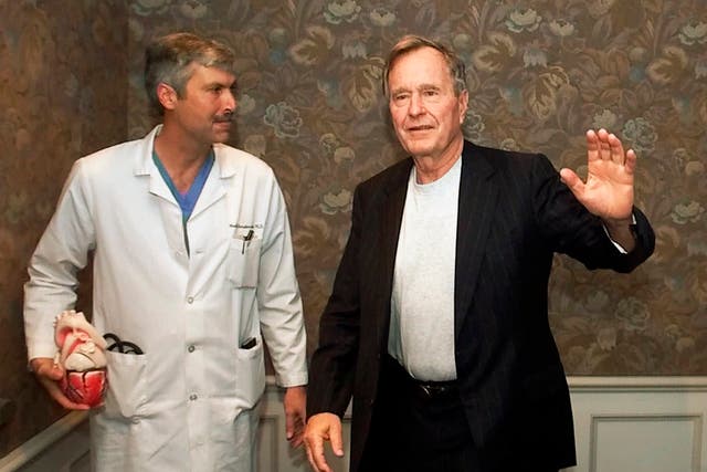 Mark Hausknecht (left), who once treated former president George W Bush, was fatally shot by a fellow bicyclist on Friday 20 July