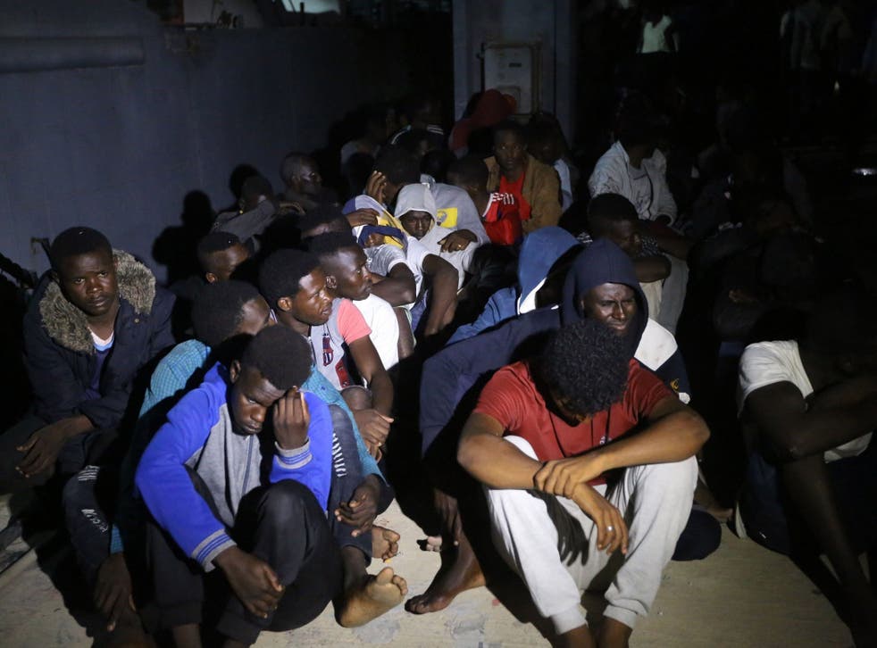 Migrants arrive at a naval base in Tripoli, after being rescued off the coast of Zawia