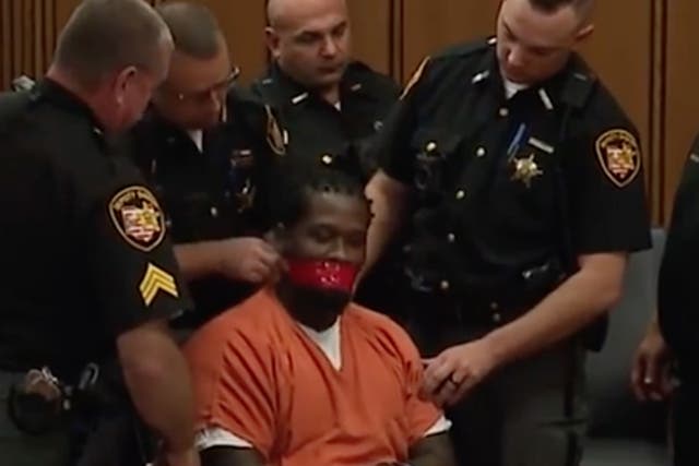 Franklyn Williams was surrounded by police and had tape placed over his mouth in an Ohio courtroom by Judge John Russo
