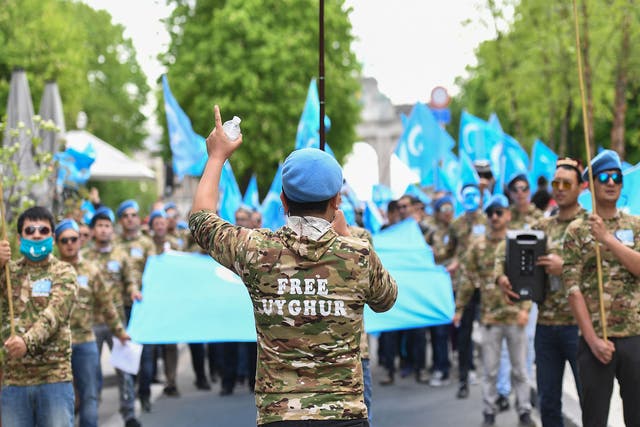 Uighur demonstrators in Brussels in April urge EU politicians to act against what they claim is a campaign to crush religious and cultural freedom in China