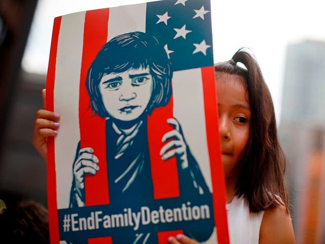 A girl takes part in a protest in Chicago against the US immigration policies separating migrant families.
