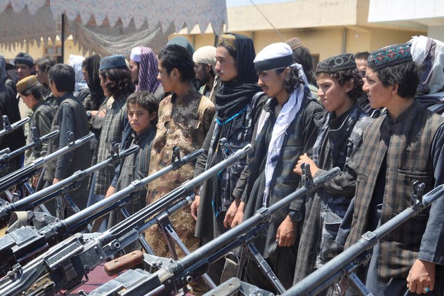 Isis fighters who surrendered to Afghan forces stand during a ceremony in Sheberghan, capital of Jawzjan province