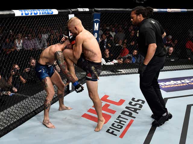 TJ Dillashaw beat rival Cody Garbrandt with a first-round stoppage to retain the UFC bantamweight title