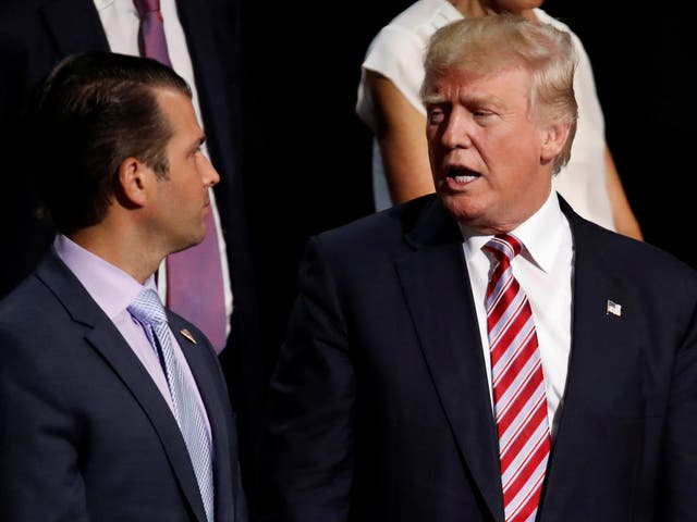 Donald Trump Jr talks with his father, Donald Trump during the 2016 Republican National Convention in Cleveland.