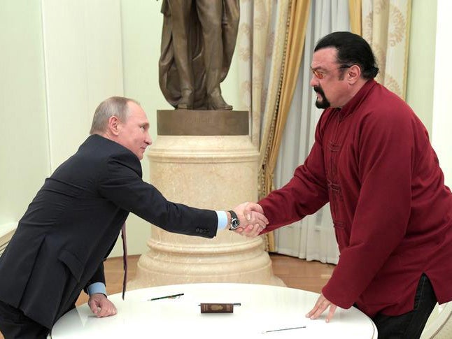 President Putin shakes hands with Steven Seagal during a meeting at the Kremlin in November 2016