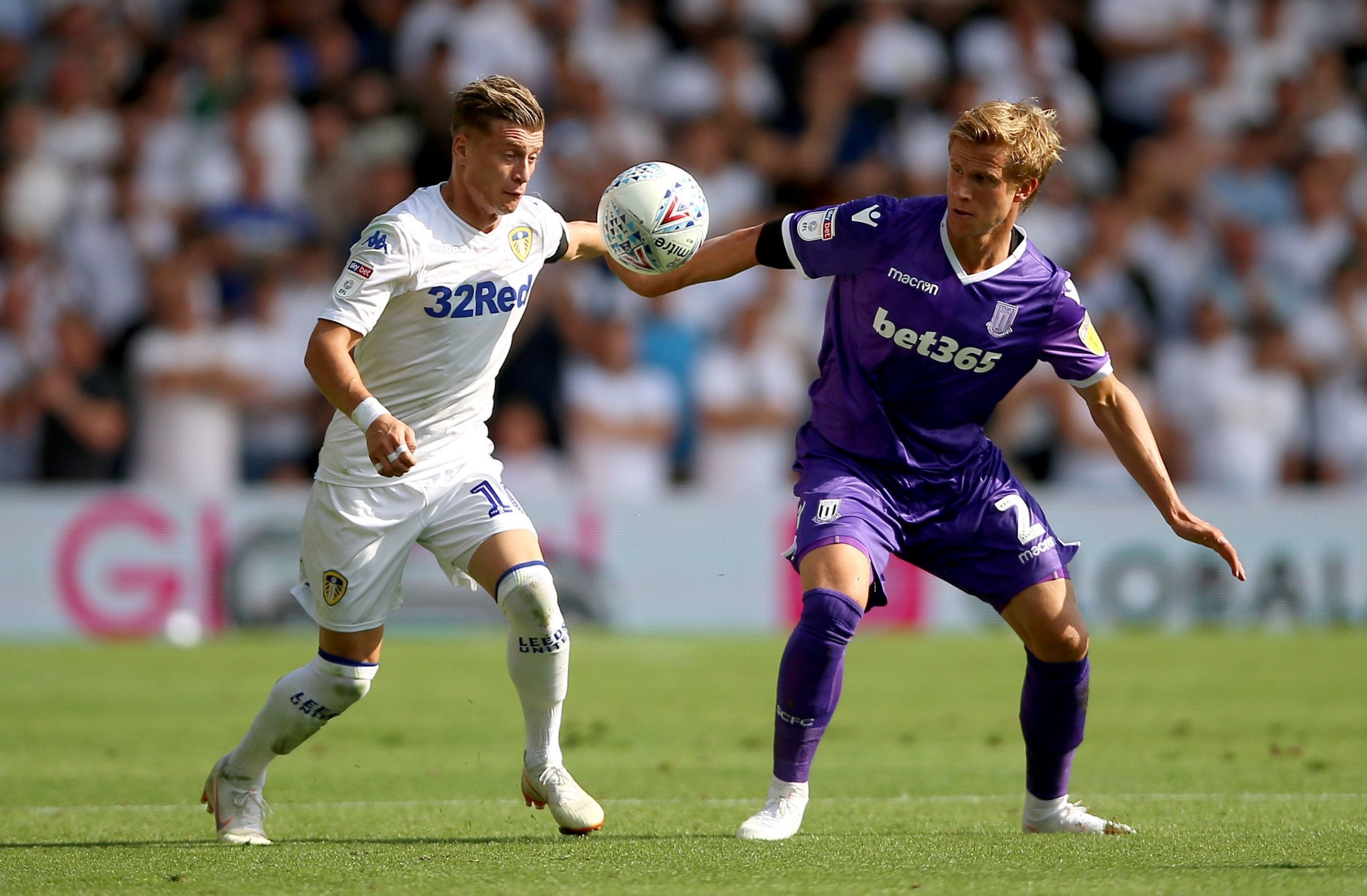 Ezgjan Alioski and Moritz Bauer battle for the ball