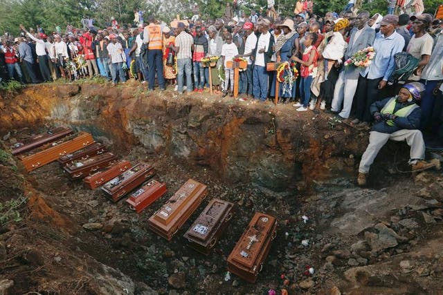 Mass burial of people killed when a dam burst its walls in Kenya
