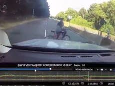 Dashcam video captures moment child cycling is almost hit
