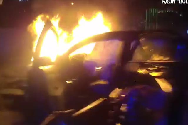 Officers subdued the flames before dragging the passenger to safety.