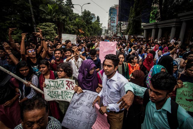 Bangladeshi students march along a street during a student protest in Dhaka