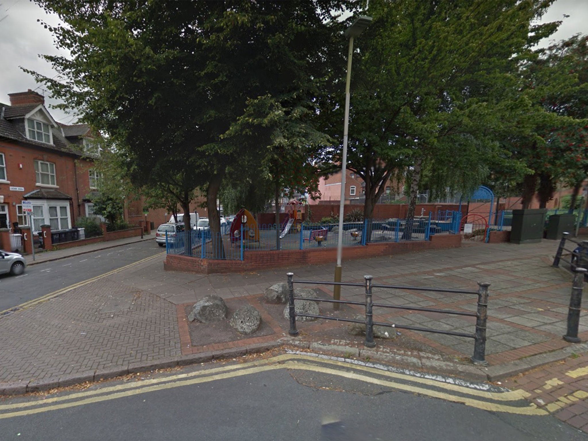 The woman was found seriously injured near a children's play area in Leicester